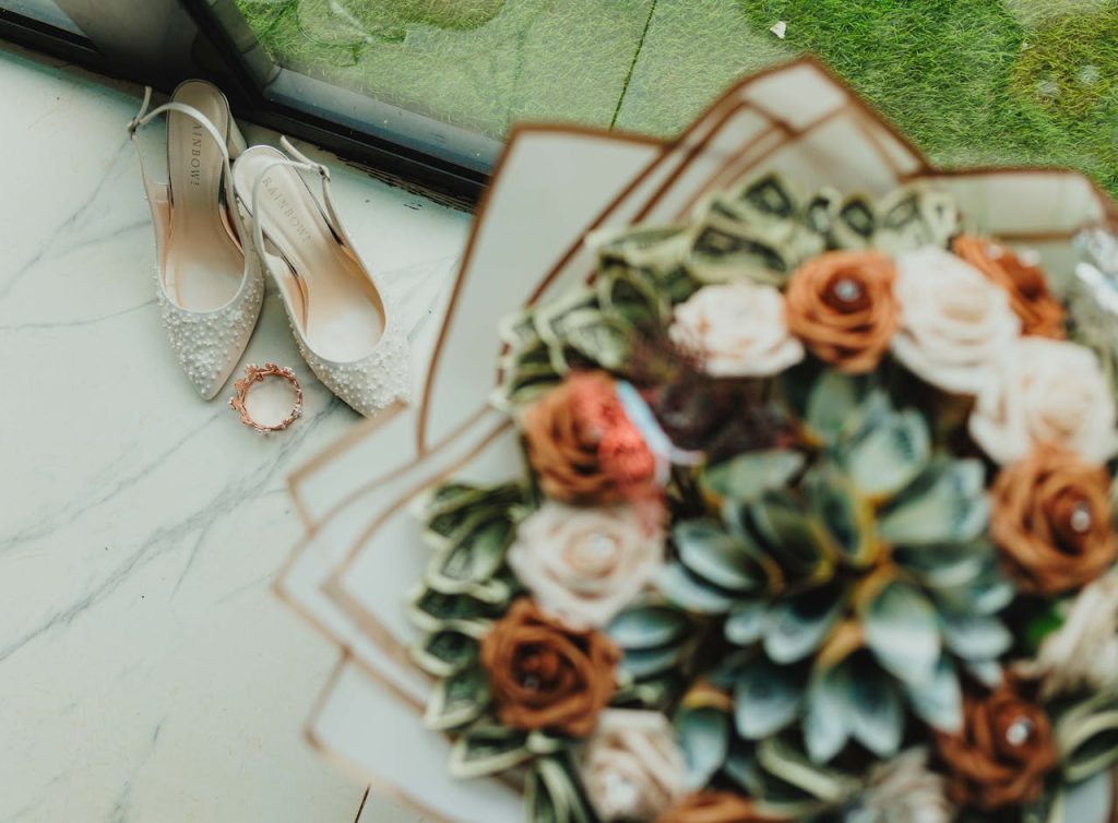 Elegant bridal shoes and a bouquet with succulents perfect for a stylish wedding.